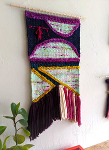 Figures in Purple Weaving