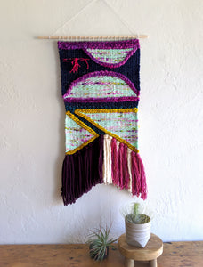 Figures in Purple Weaving